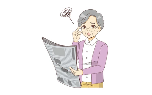 老眼で新聞の文字が見えにくい女性高齢者