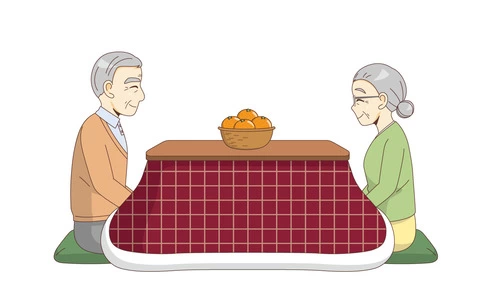 こたつで温まる高齢者夫婦