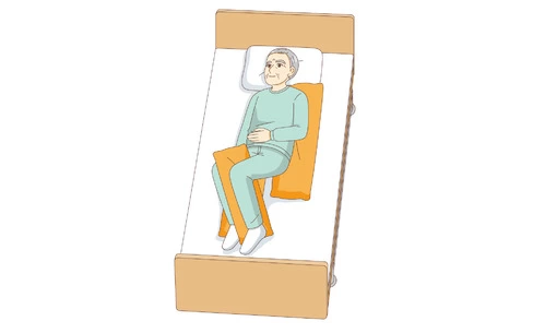 半側臥位（足元から見た状態）（高齢者（おじいさん・おばあさん）/介護現場の人物）