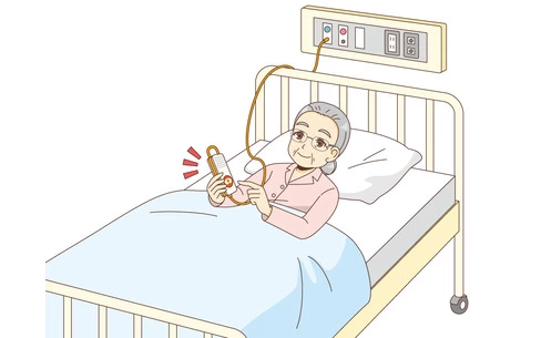 ナースコールを押す女性高齢者（高齢者（おばあさん・おじいさん）/介護現場の人物）