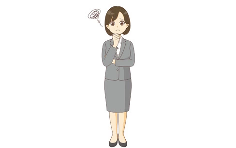 困っているスーツを着た女性