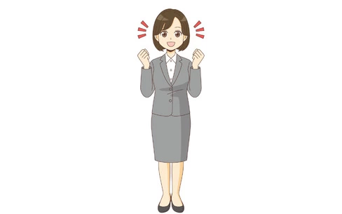 ガッツポーズするスーツを着た女性