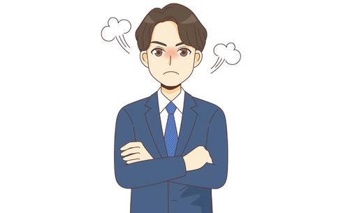 怒っているスーツを着た男性（バストアップ）