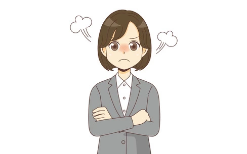 怒っているスーツを着た女性（バストアップ）