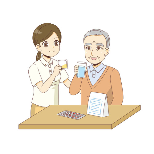 薬を飲む男性高齢者を見守る介護職（薬・服薬/介護・生活）