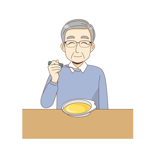 自助食器（お皿・スプーン）を使ってミキサー食を食べる男性高齢者（食事・食事介助/介護・生活）