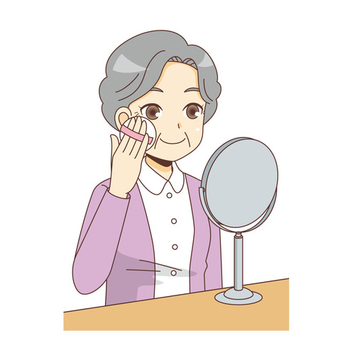 メイクをする女性高齢者（高齢者（おばあさん・おじいさん）/介護現場の人物）