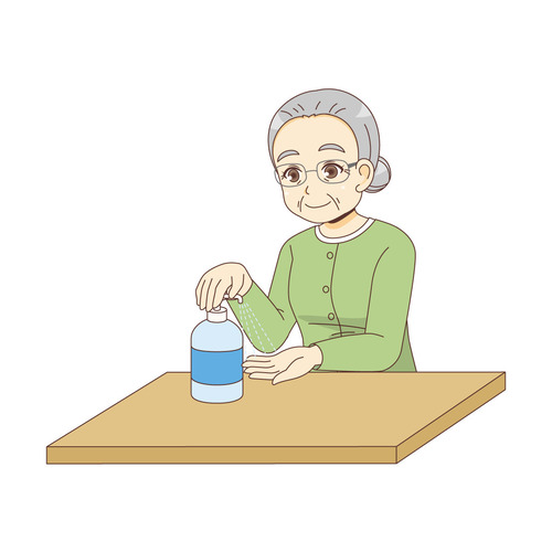 手を消毒する女性高齢者（高齢者（おばあさん・おじいさん）/介護現場の人物）