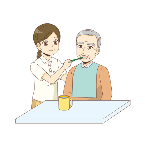 男性高齢者の口腔ケアを行う女性介護職（老人ホーム・介護施設/施設・サービス）